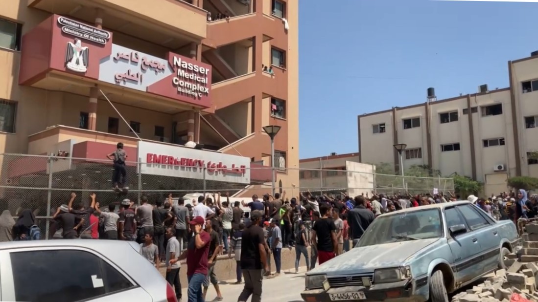 View of Nasser Hospital facade in Gaza from outside on the street with people queing