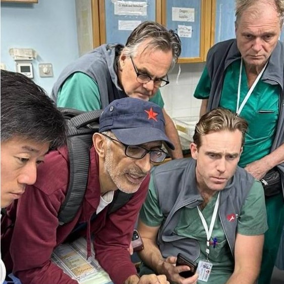 Five surgeons in Gaza reviewing a patient