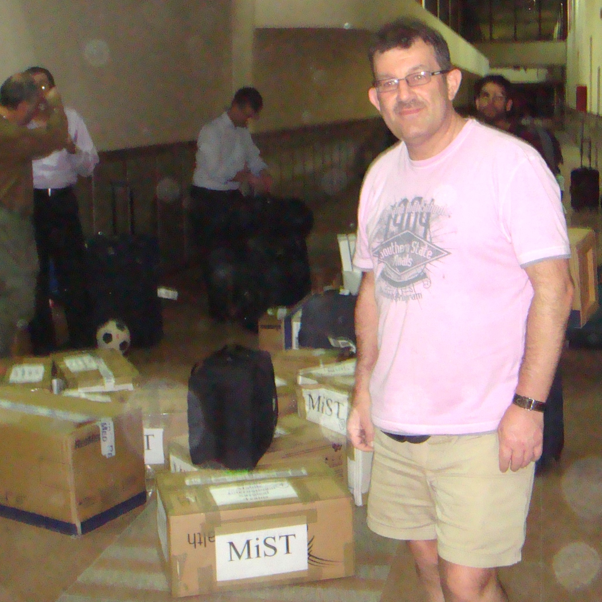 Peter Naylor stands at Gaza border next to boxes of MIST equipment